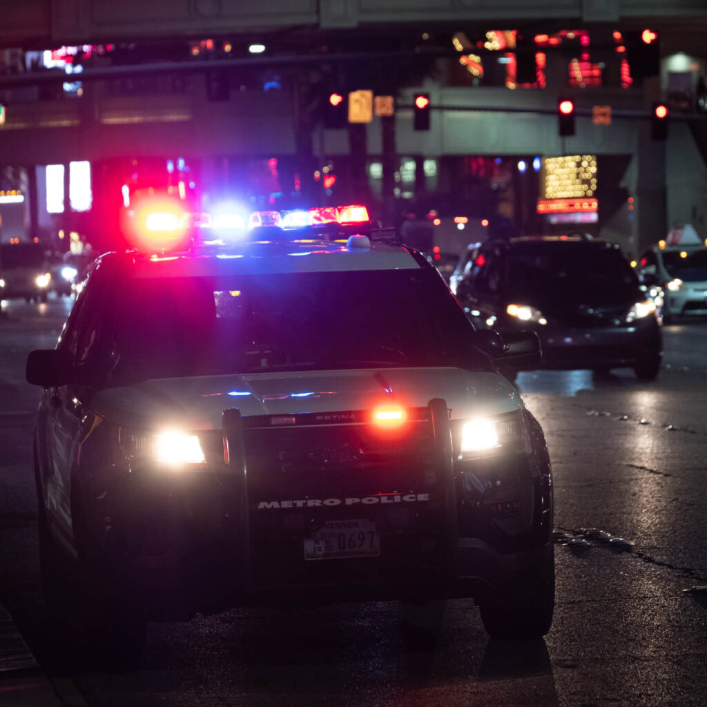 Photo of a police car with lights flashing
